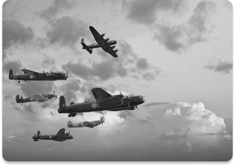 Vintage military aircraft flying in formation.